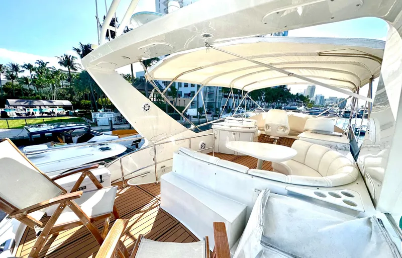 Slide: The Image of Luxurious 2007 Marquis 59 Markham Edition yacht with spacious deck and seating area. - 23
