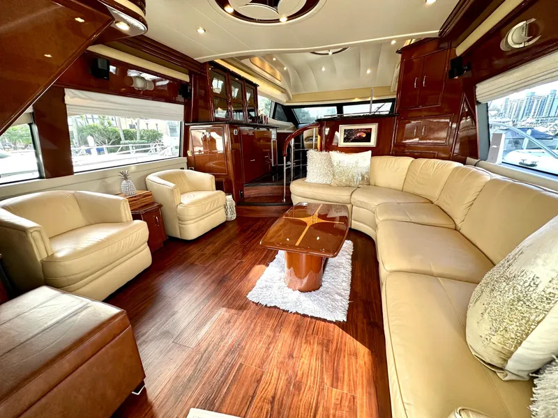 Slide: The Image of Luxurious 2007 Marquis 59 Markham Edition yacht interior with elegant leather seating and wood finishes. - 24