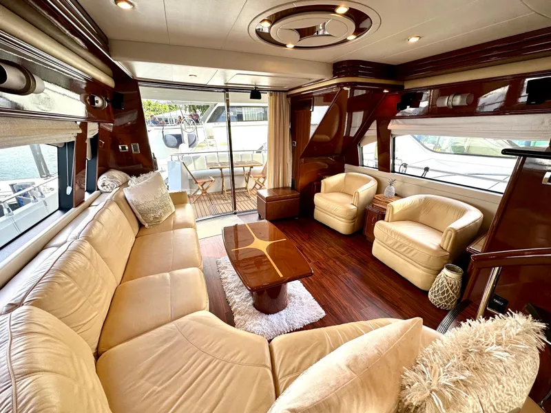 Slide: The Image of Luxurious interior of 2007 Marquis 59 Markham Edition yacht with plush seating and elegant decor. - 27