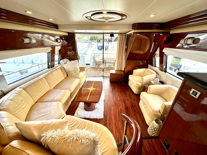 Slide: The Image of Luxurious 2007 Marquis 59 Markham Edition yacht interior with plush seating and elegant wood finishes. - 28