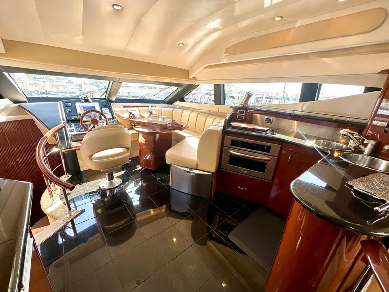 Slide: The Image of Luxurious interior of 2007 Marquis 59 Markham Edition yacht with modern kitchen and seating area. - 30