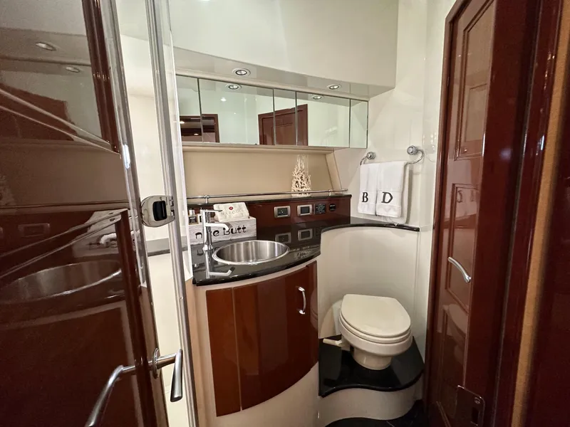 Slide: The Image of Luxurious 2007 Marquis 59 Markham Edition yacht bathroom with modern fixtures and elegant wood finishes. - 35