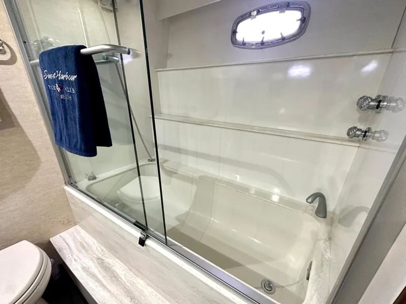 Slide: The Image of Luxurious 2007 Marquis 59 Markham Edition yacht bathroom with glass shower and towel. - 47