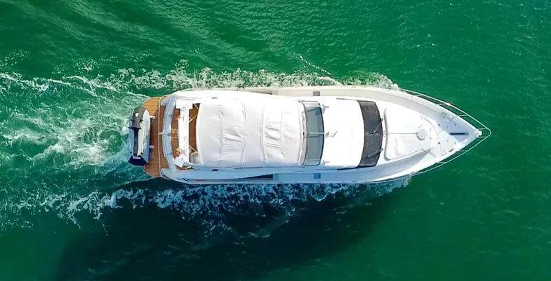 Slide: The Image of Aerial view of 2007 Marquis 59 Markham Edition yacht cruising on green water. - 8