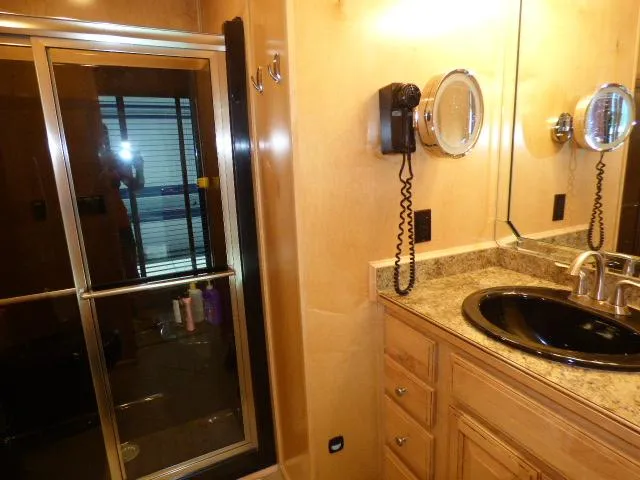Slide: The Image of Luxurious bathroom in 2009 Sumerset 19x105 houseboat with granite countertop and glass shower. - 11