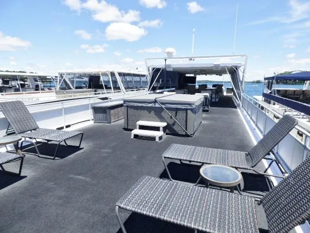 Slide: The Image of Luxurious 2009 Sumerset 19x105 houseboat with spacious deck and lounge chairs. - 18