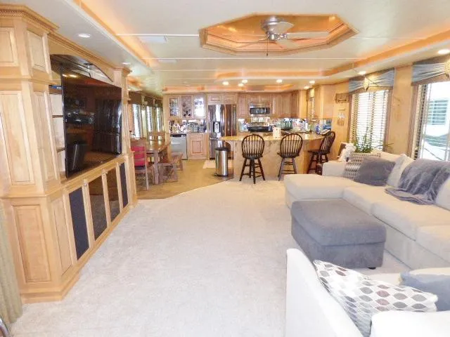 Slide: The Image of Luxurious 2009 Sumerset 19x105 houseboat interior with spacious living area and modern kitchen. - 2