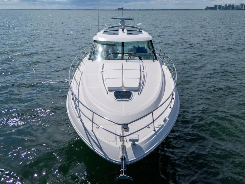 Slide: The Image of 2011 Sea Ray 470 Sundancer yacht cruising on open water. - 13