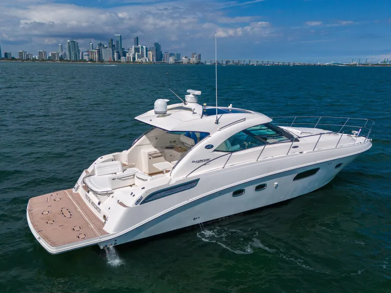Slide: The Image of 2011 Sea Ray 470 Sundancer yacht cruising near city skyline. - 18
