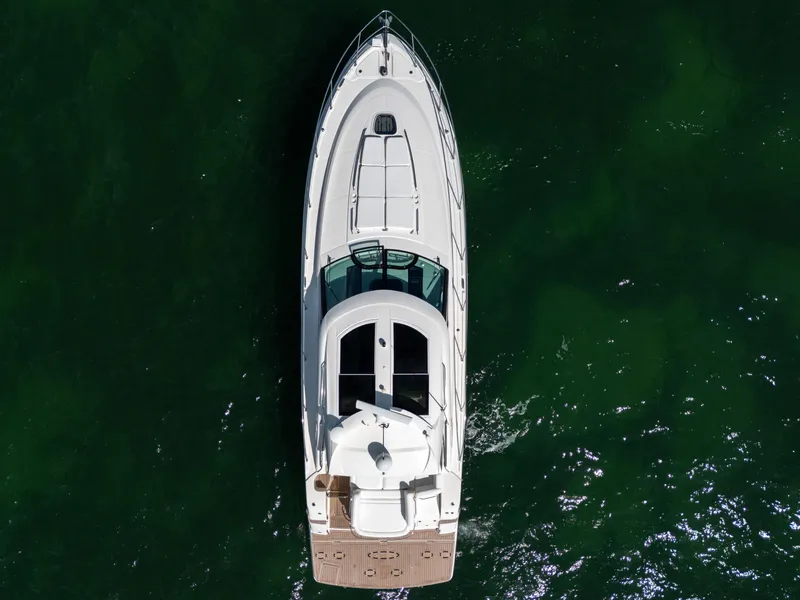 Slide: The Image of Aerial view of 2011 Sea Ray 470 Sundancer yacht on green water. - 22