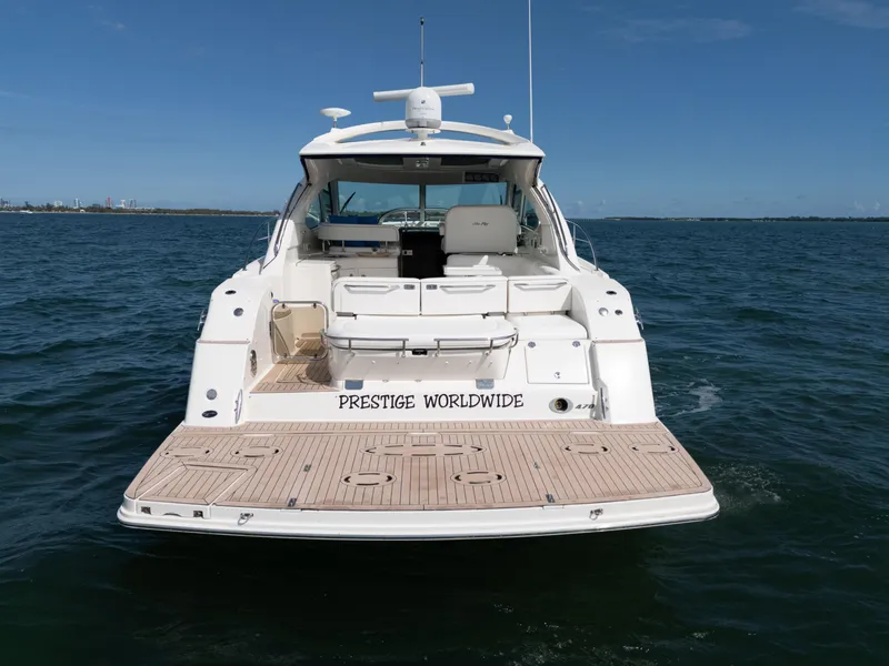 Slide: The Image of 2011 Sea Ray 470 Sundancer yacht on open water, rear view. - 34