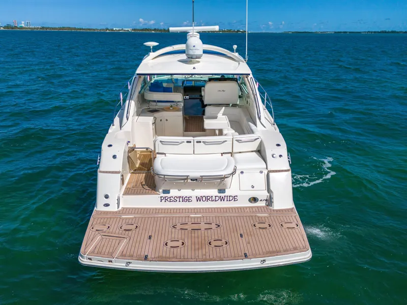 Slide: The Image of 2011 Sea Ray 470 Sundancer yacht on open water, rear view. - 35