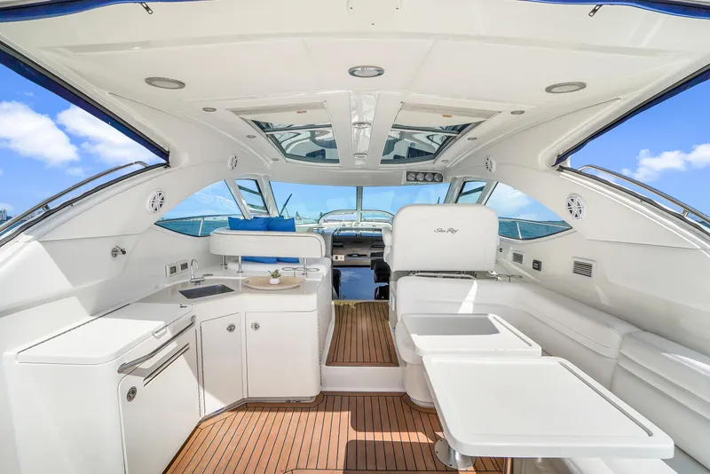 Slide: The Image of Interior of 2011 Sea Ray 470 Sundancer yacht with modern design and wooden flooring. - 46
