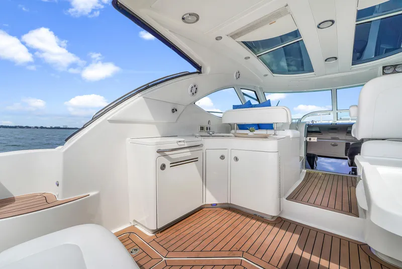 Slide: The Image of 2011 Sea Ray 470 Sundancer yacht interior with sleek design and wooden flooring. - 47