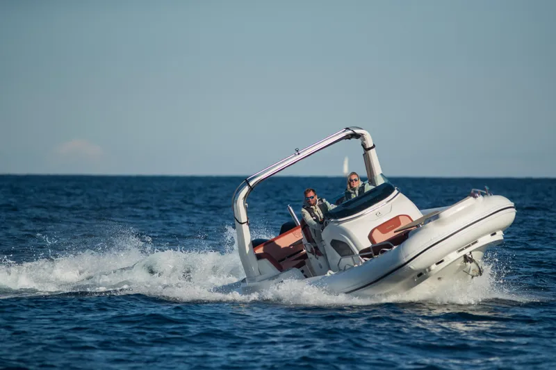 Slide: The Image of 2025 Zodiac Medline 9 boat cruising on open water, showcasing sleek design and performance. - 11