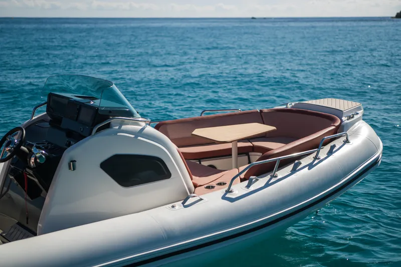 Slide: The Image of 2025 Zodiac Medline 9 boat on clear blue water, featuring a sleek design and comfortable seating. - 17
