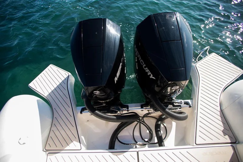 Slide: The Image of 2025 Zodiac Medline 9 boat with dual Mercury outboard engines on water. - 18