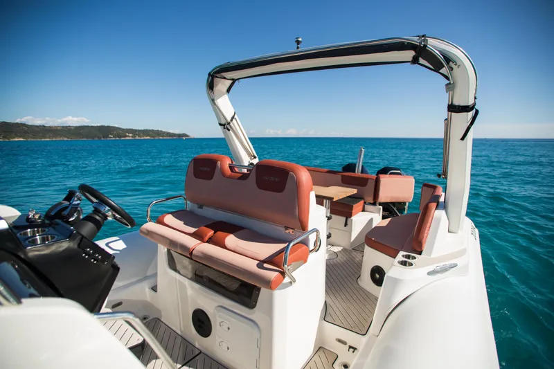 Slide: The Image of 2025 Zodiac Medline 9 boat interior with seating, steering wheel, and ocean view. - 3
