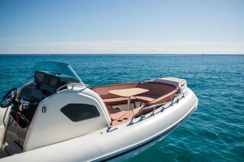 Slide: The Image of 2025 Zodiac Medline 9 boat on clear blue ocean water. - 4