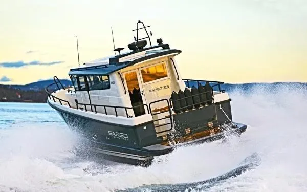 The Image of 2025 Sargo Explorer boat navigating through waves at sea. - 1