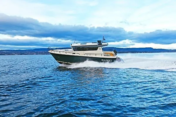 Slide: The Image of 2025 Sargo EXPLORER boat cruising on open water under a cloudy sky. - 3