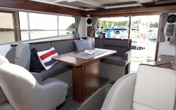 Slide: The Image of Interior of 2025 Sargo EXPLORER boat with cozy seating and dining area. - 7