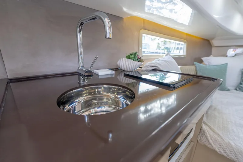 Slide: The Image of Luxurious interior of 2025 Hanover 347 Outboard yacht with modern kitchen amenities. - 18