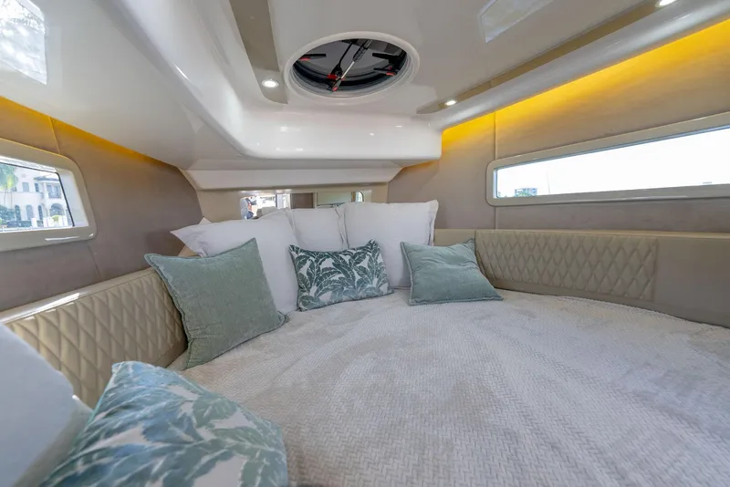 Slide: The Image of Luxurious cabin interior of 2025 Hanover 347 Outboard with plush bedding and ambient lighting. - 19