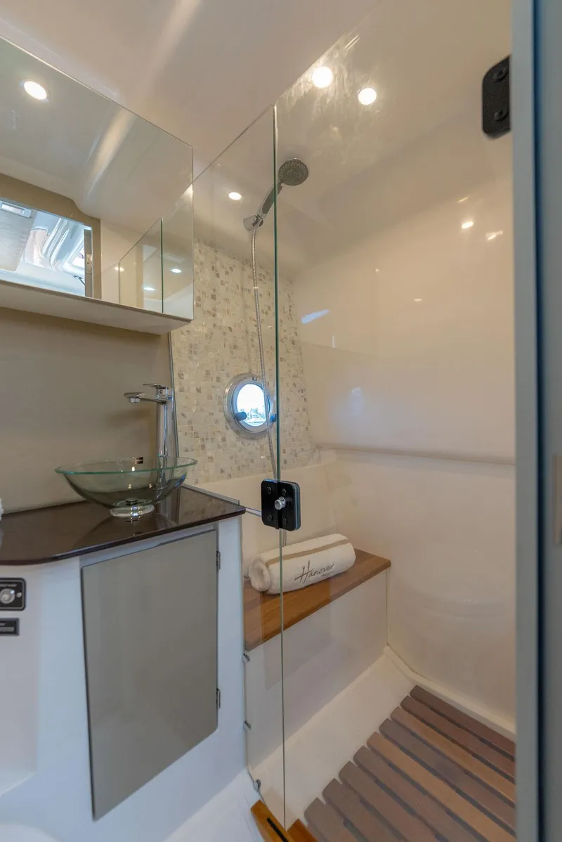Slide: The Image of Modern bathroom in 2025 Hanover 347 Outboard boat with glass shower and sleek fixtures. - 20
