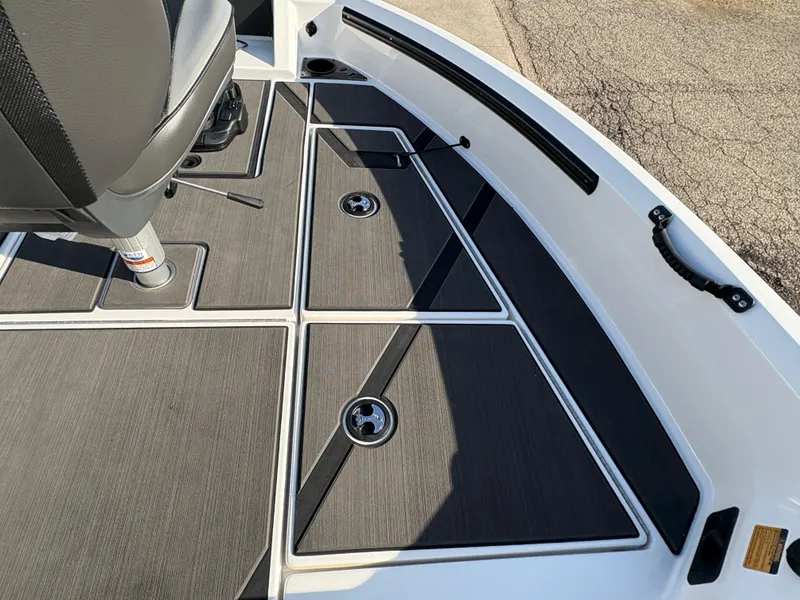 Slide: The Image of 2025 Lund 185 Impact GL boat interior with sleek seating and storage compartments. - 16