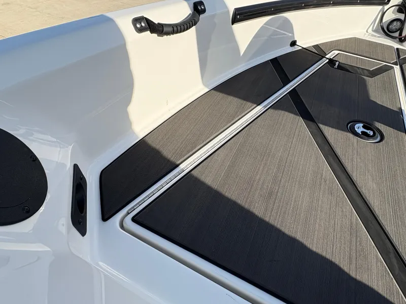 Slide: The Image of 2025 Lund 185 Impact GL boat interior with sleek, modern design and durable flooring. - 18