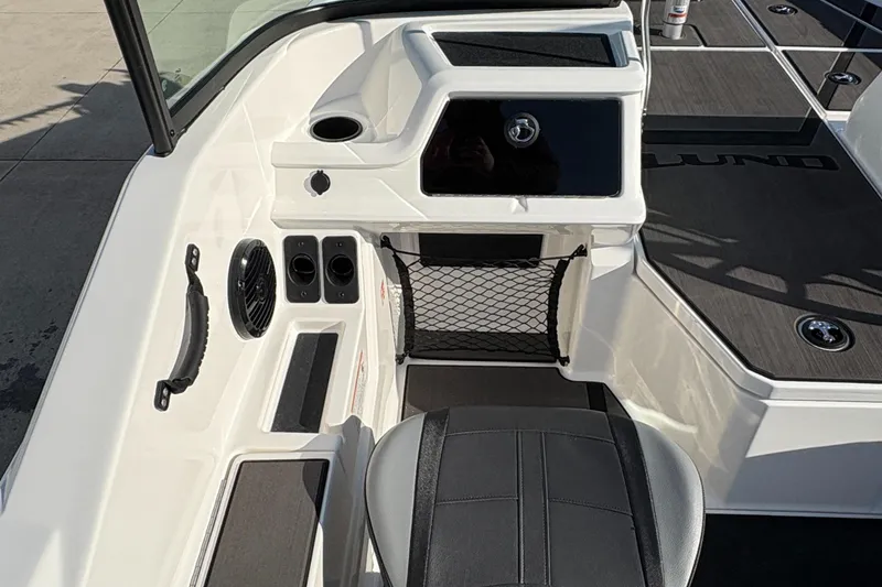 Slide: The Image of 2025 Lund 185 Impact GL boat interior with seating and storage compartments. - 24