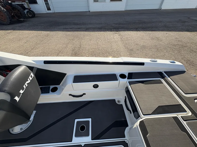 Slide: The Image of 2025 Lund 185 Impact GL boat interior with seating and storage compartments. - 29