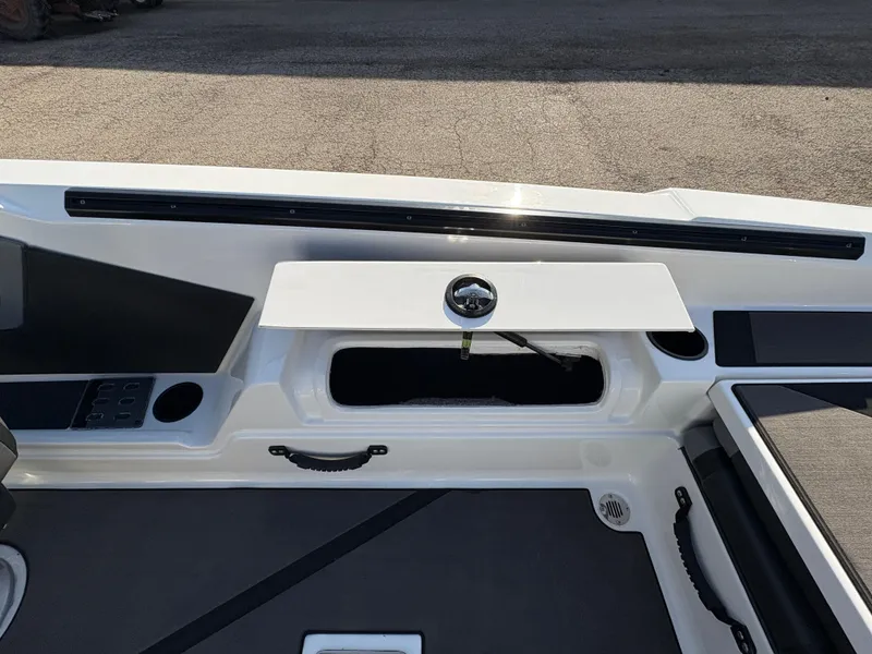 Slide: The Image of 2025 Lund 185 Impact GL boat interior with storage compartment and sleek design. - 30
