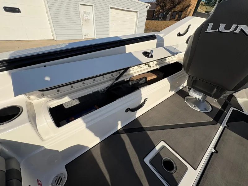 Slide: The Image of 2025 Lund 185 Impact GL boat interior with open storage compartment. - 32