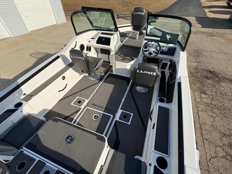 Slide: The Image of 2025 Lund 185 Impact GL boat interior with seating and console, featuring modern design and functionality. - 37