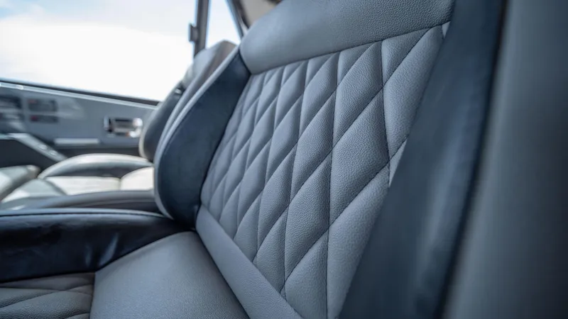 Slide: The Image of Luxurious interior of 2025 Hanover 387 Outboard with diamond-stitched leather seats. - 16