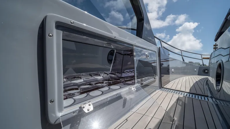 Slide: The Image of Sleek Hanover 387 Outboard yacht deck, 2025 model, with modern design and clear skies. - 26