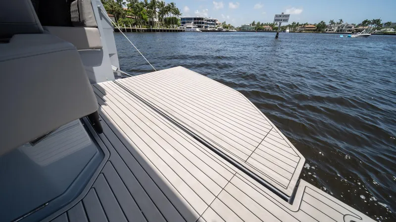 Slide: The Image of 2025 Hanover 387 Outboard boat deck on calm water. - 28