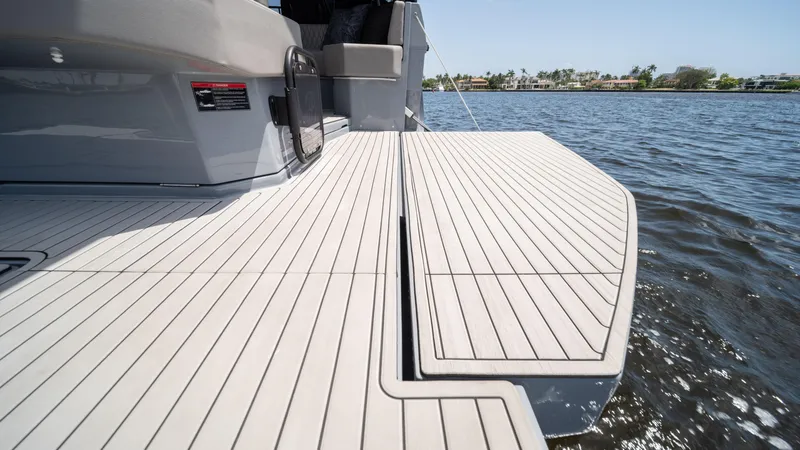 Slide: The Image of Modern 2025 Hanover 387 Outboard boat deck on calm water. - 29