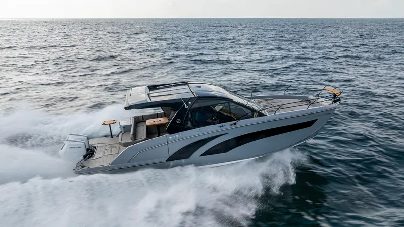 Slide: The Image of 2025 Hanover 387 Outboard cruising on open water, showcasing sleek design and performance. - 3