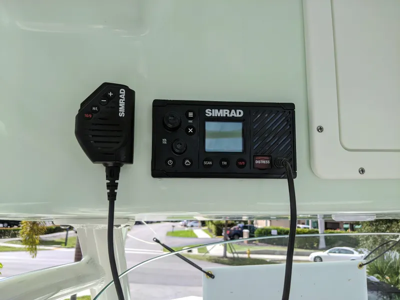 Slide: The Image of Simrad marine radio system on 2021 Sea Born LX26 boat dashboard. - 10