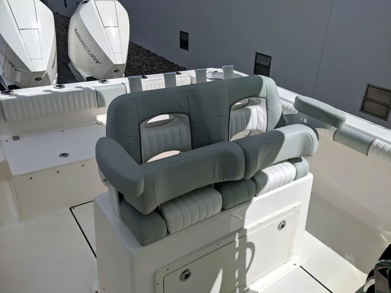 Slide: The Image of 2021 Sea Born LX26 boat interior with cushioned seating and dual Mercury engines. - 17