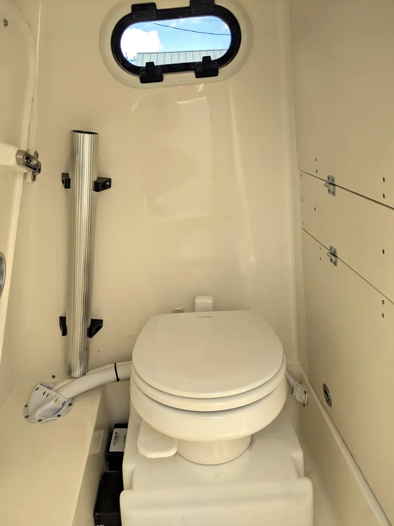 Slide: The Image of 2021 Sea Born LX26 boat interior with compact marine toilet. - 20