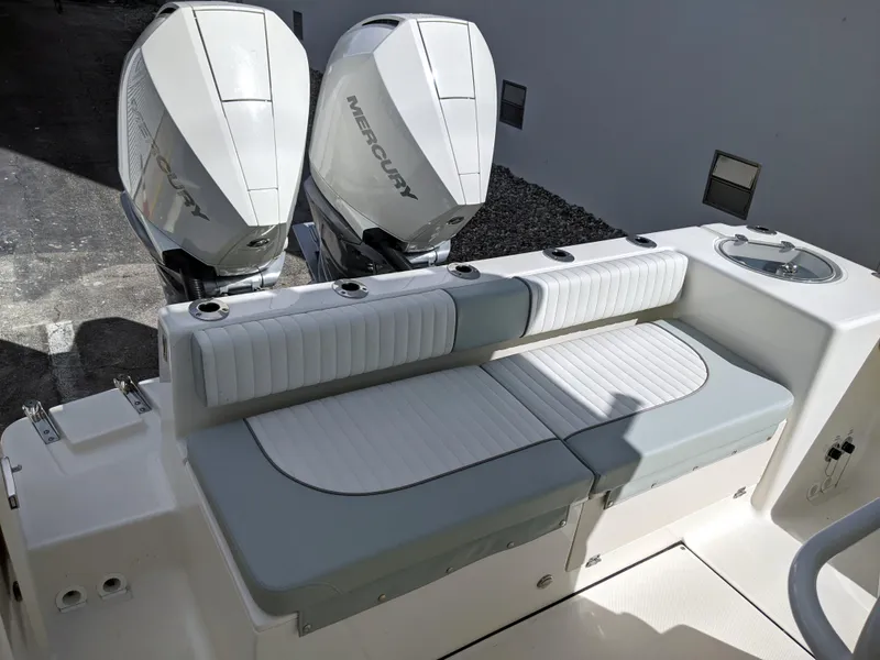 Slide: The Image of 2021 Sea Born LX26 boat with twin Mercury engines and cushioned seating. - 37