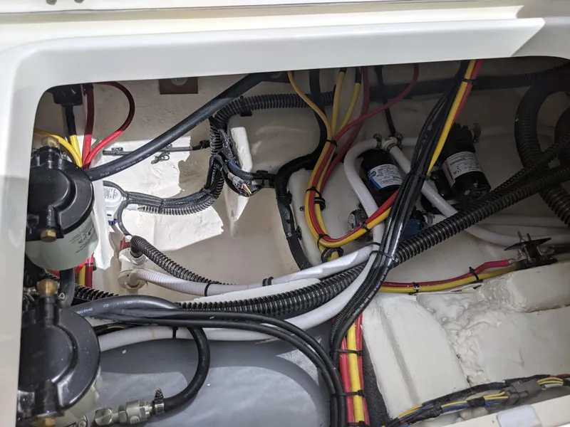 Slide: The Image of 2021 Sea Born LX26 boat wiring and components in engine compartment. - 38