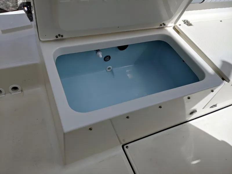 Slide: The Image of 2021 Sea Born LX26 boat livewell with open lid, showcasing interior. - 39