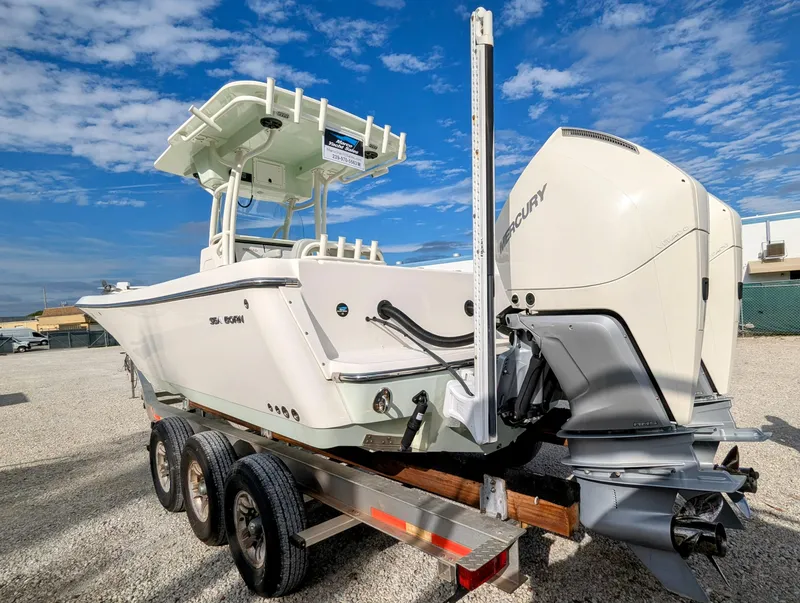 Slide: The Image of 2021 Sea Born LX26 boat on trailer with Mercury outboard motor. - 4