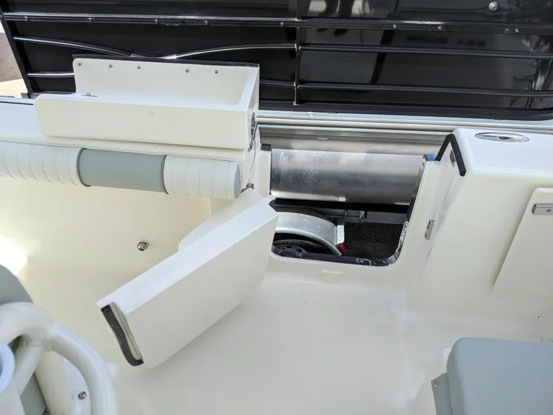 Slide: The Image of 2021 Sea Born LX26 boat interior with open storage compartments. - 42
