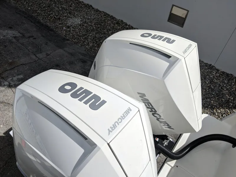 Slide: The Image of Twin Mercury outboard engines on a 2021 Sea Born LX26 boat. - 5